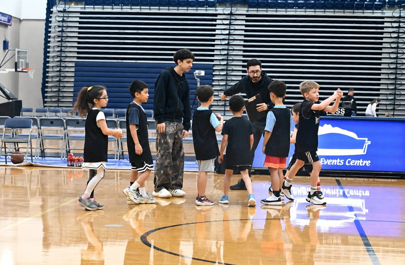 Young North Langley players high-fiving their coaches at the Langley Events Centre