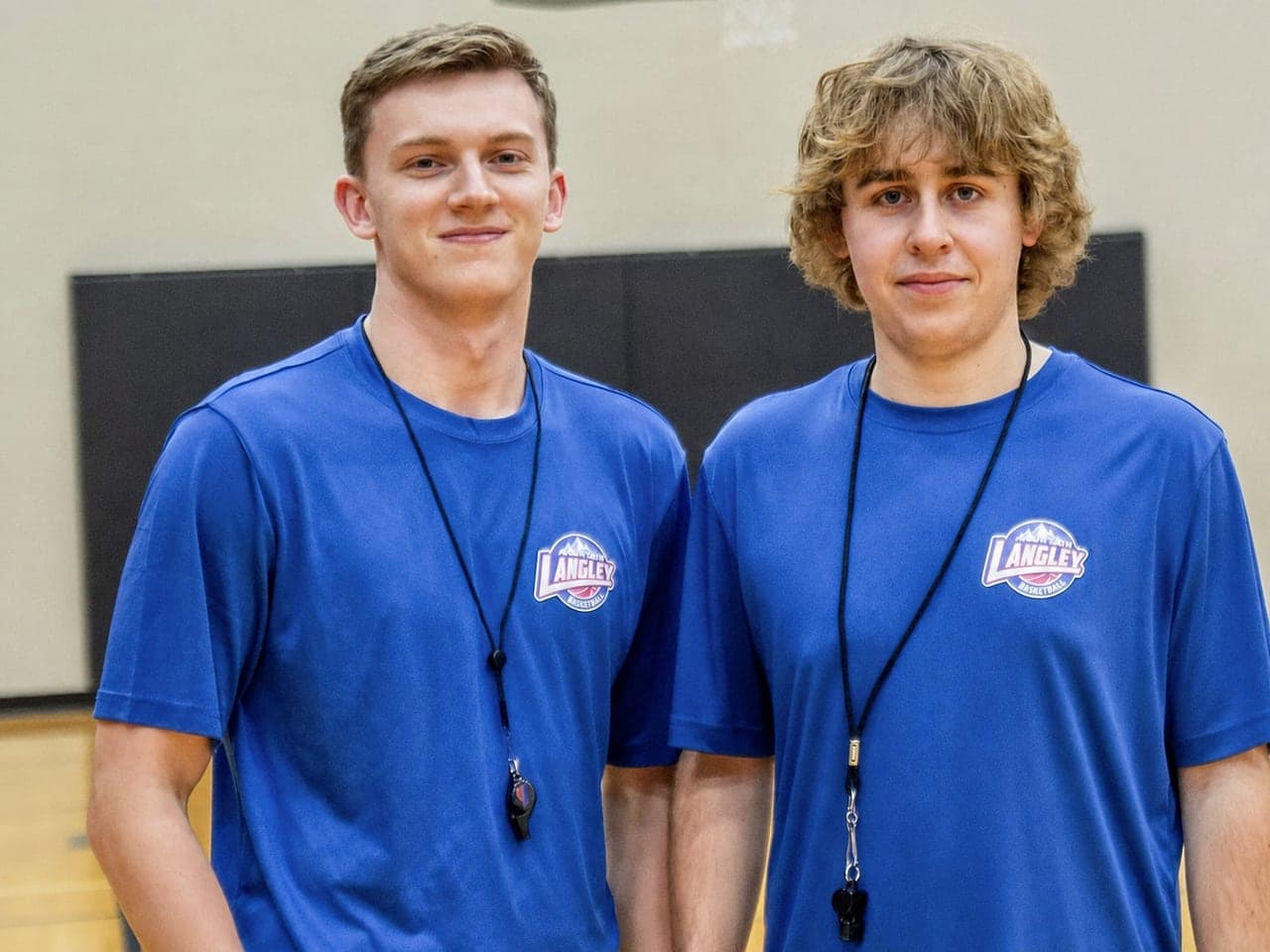 Two young North Langley Basketball referees in the gym
